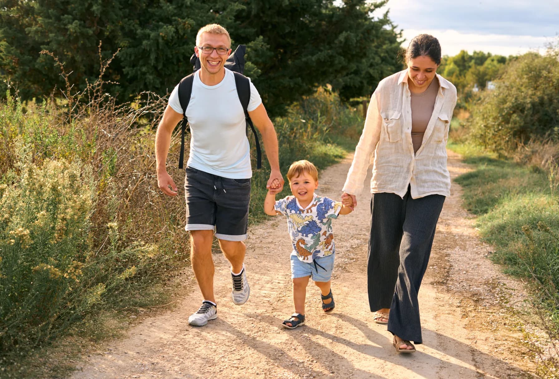 Couple running with a child
